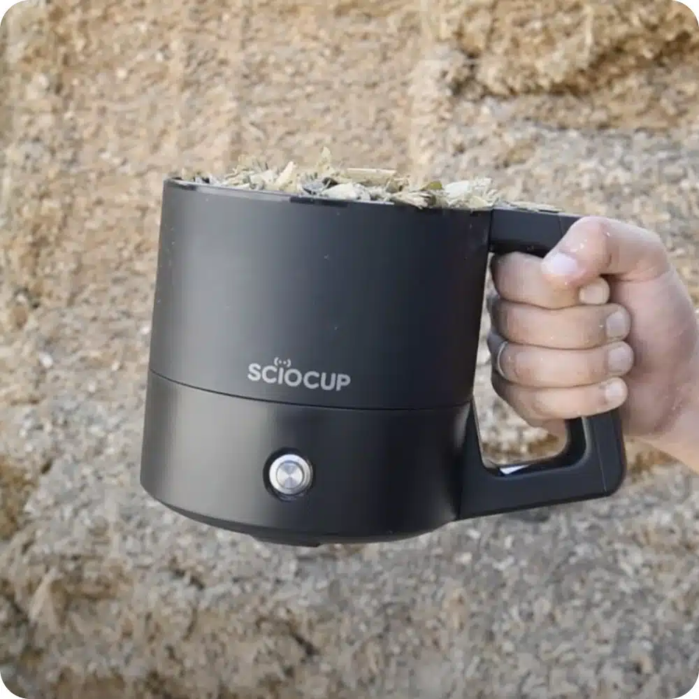 Scio Cup in the hand of a farmer